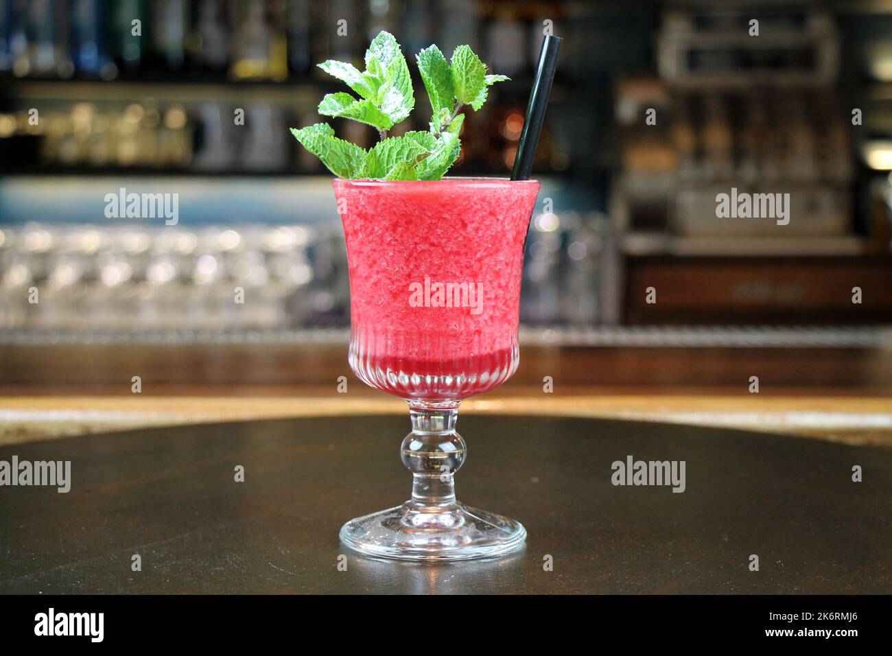 Popular summer fruit coctail on bar interior buckground close-up. Stock Photo