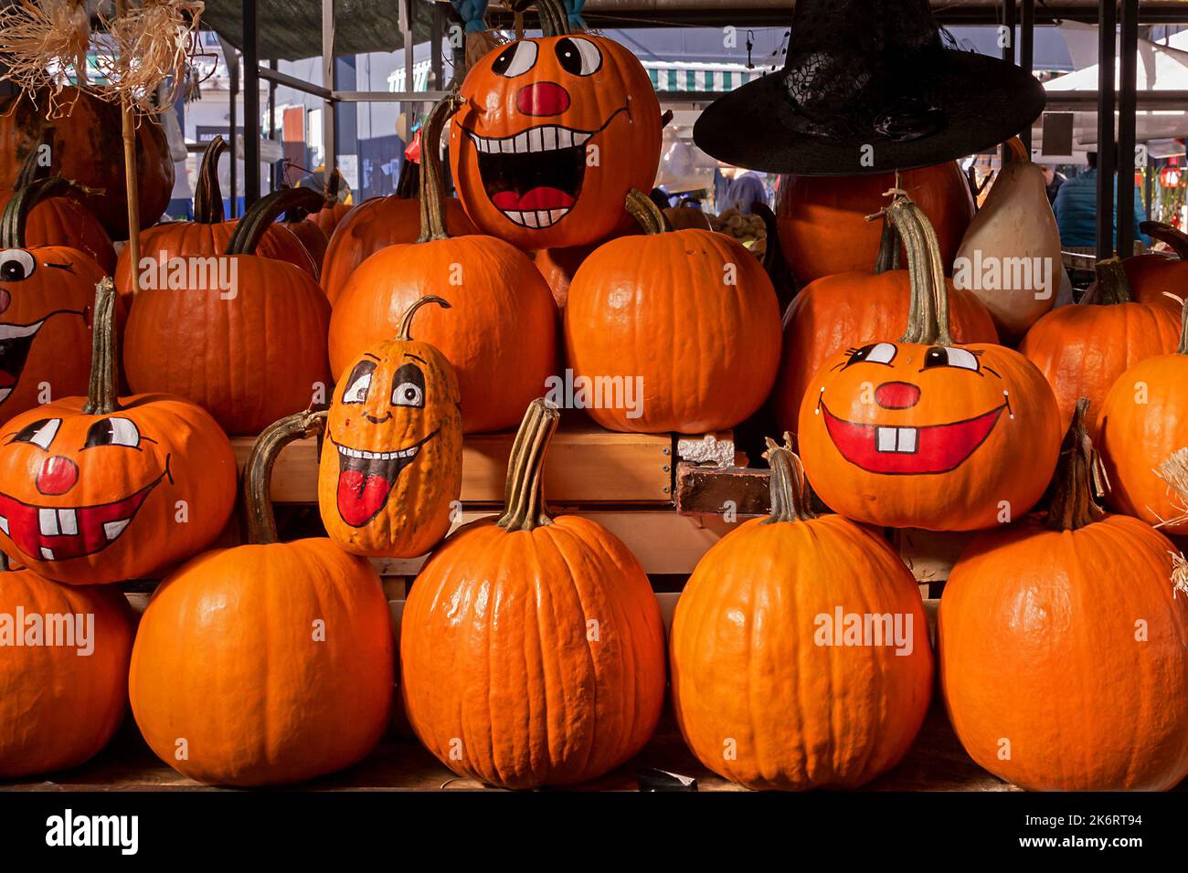Pile of pumpkins with happy faces drawings decorated for Halloween ...