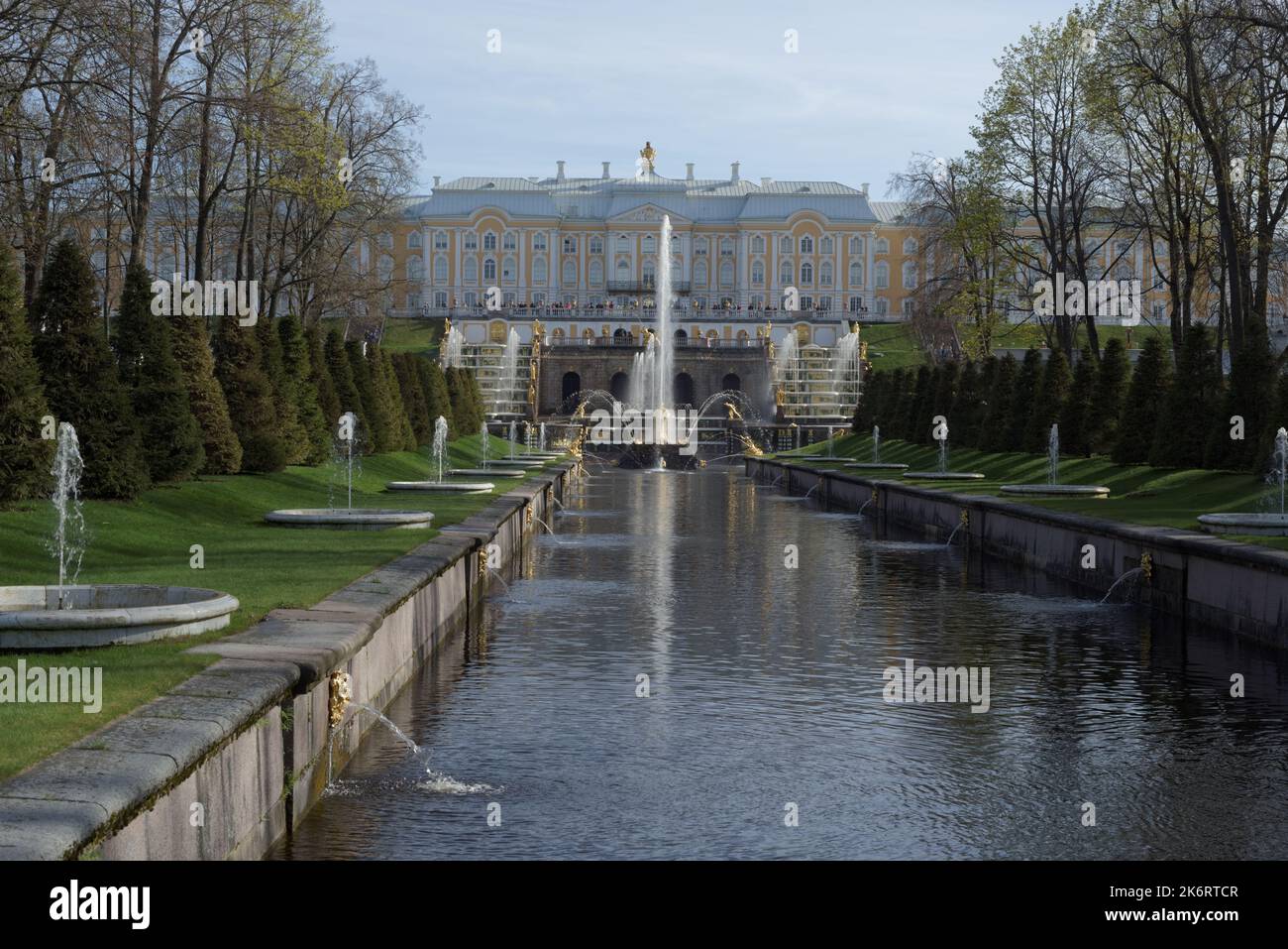 Sea canal and Grand Cascade against Grand Peterhof Palace in St. Petersburg, Russia. Former Imperial residence is listed as UNESCO World Heritage Stock Photo