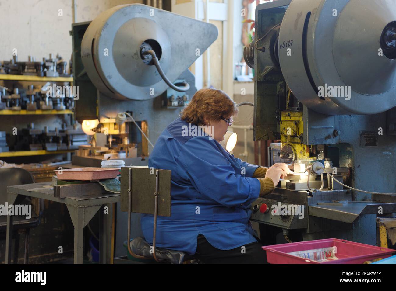 Female worker of the holding Lenpolygraphmash on her workplace. The ...