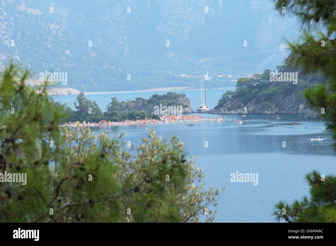 People resting on a beach in Fethiye bay, Turkey Stock Photo