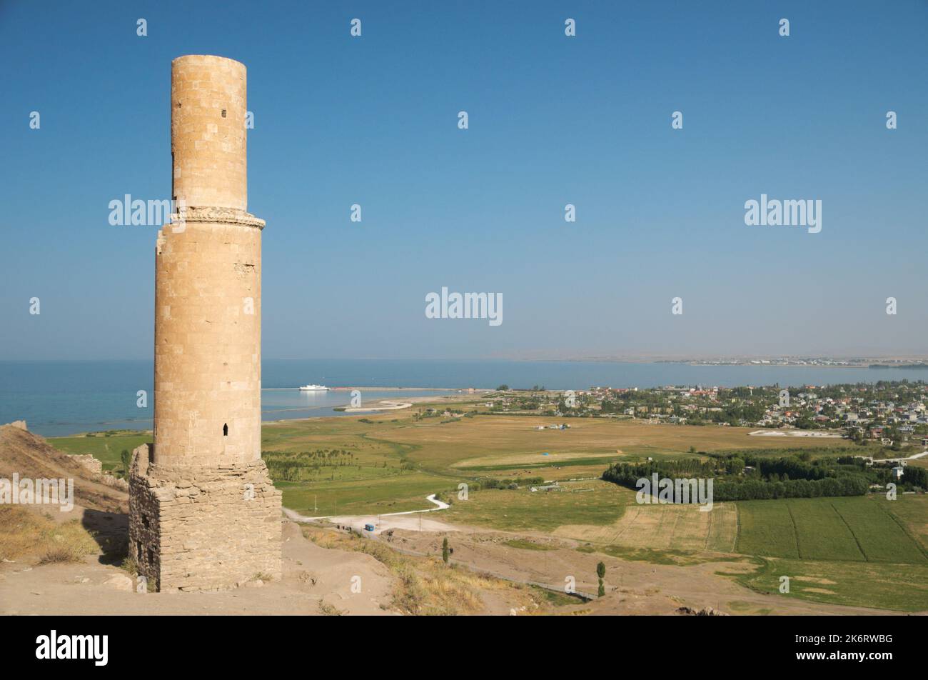 Ruined minaret at the Urartian fortress against Van lake and panoramic view of Van city, Turkey Stock Photo