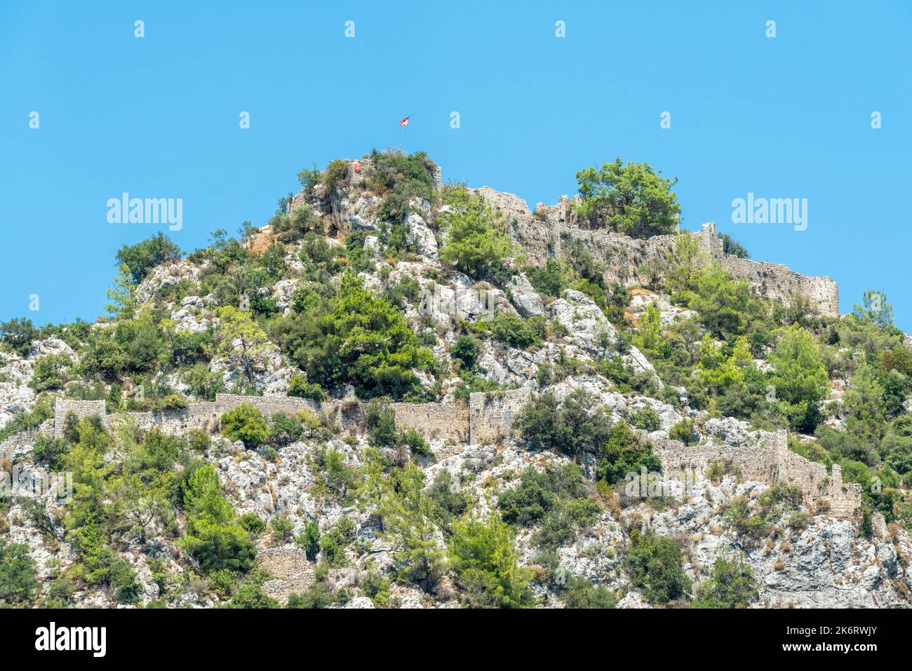 Ruins of Alara Castle sitting on a massive rocky hill in Alanya, Turkey. The castle dates from the 13th century. Stock Photo