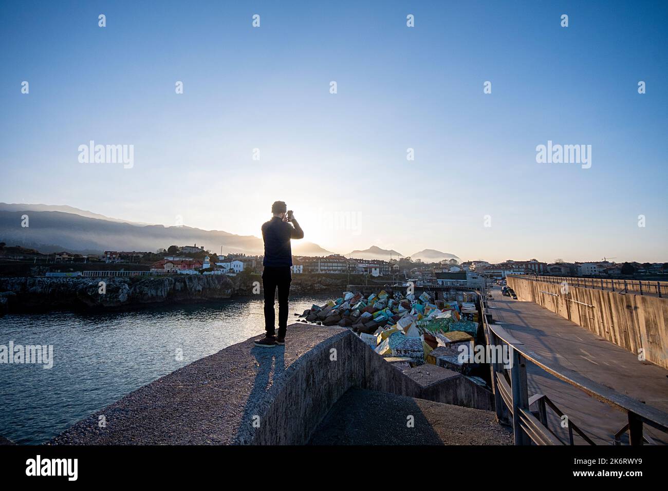 a man taking a backlight photograph Stock Photo