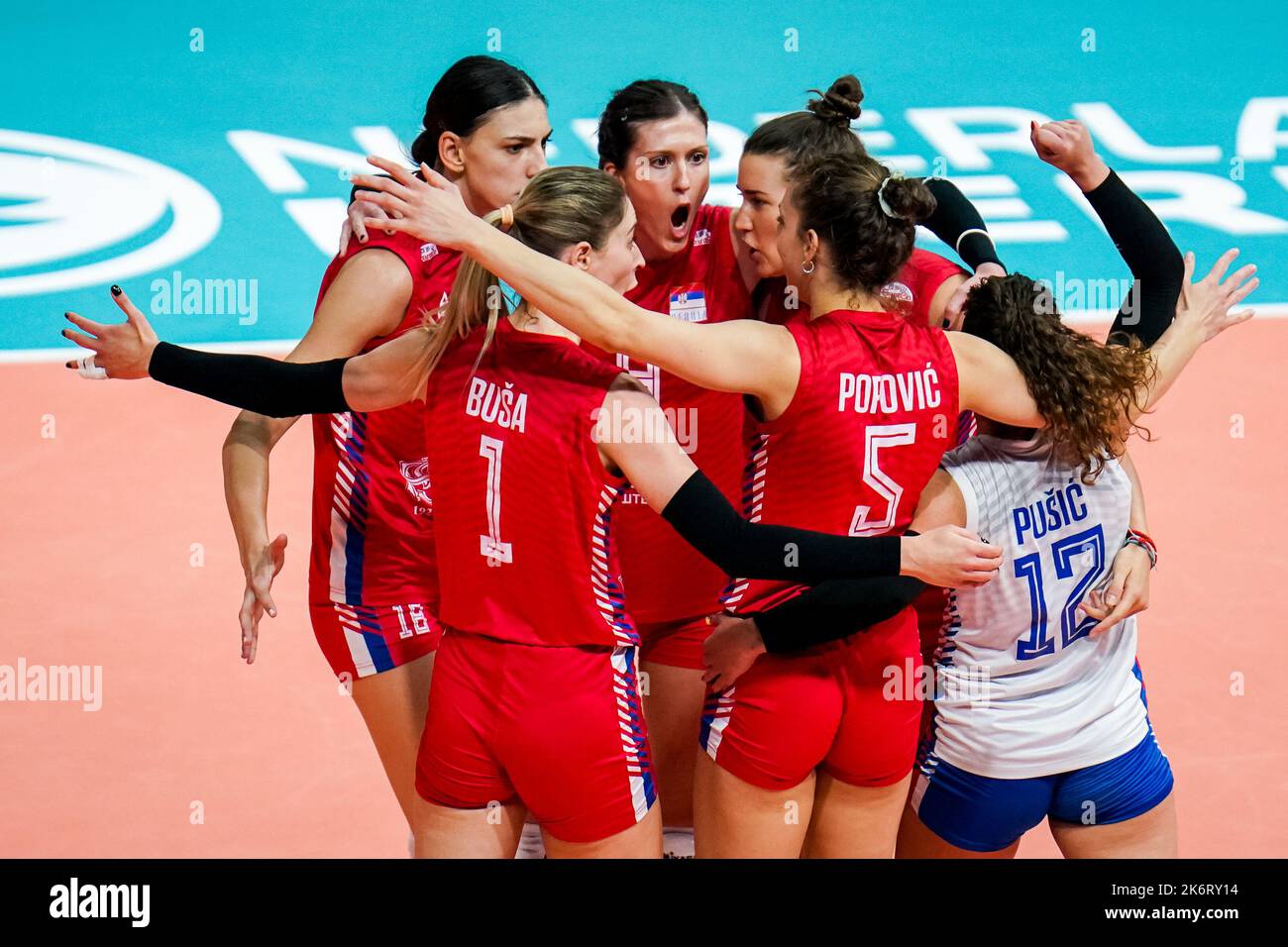 Apeldoorn, Netherlands. 15th Oct, 2022. APELDOORN, NETHERLANDS - OCTOBER 15: Bianka Busa of Serbia, Tijana Boskovic of Serbia and Bojana Drca of Serbia celebrate a point with their team mates during the Final match between Brazil and Serbia on Day 20 of the FIVB Volleyball Womens World Championship 2022 at the Omnisport Apeldoorn on October 15, 2022 in Apeldoorn, Netherlands (Photo by Rene Nijhuis/Orange Pictures) Credit: Orange Pics BV/Alamy Live News Stock Photo