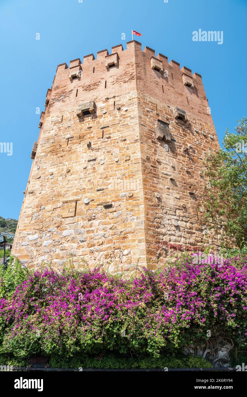 Alanya, Turkey – August 18, 2021. Red Tower in Alanya, Turkey. The five-storey octagonal defence tower was constructed in 1226 by Seljuk Sultan Alaedd Stock Photo