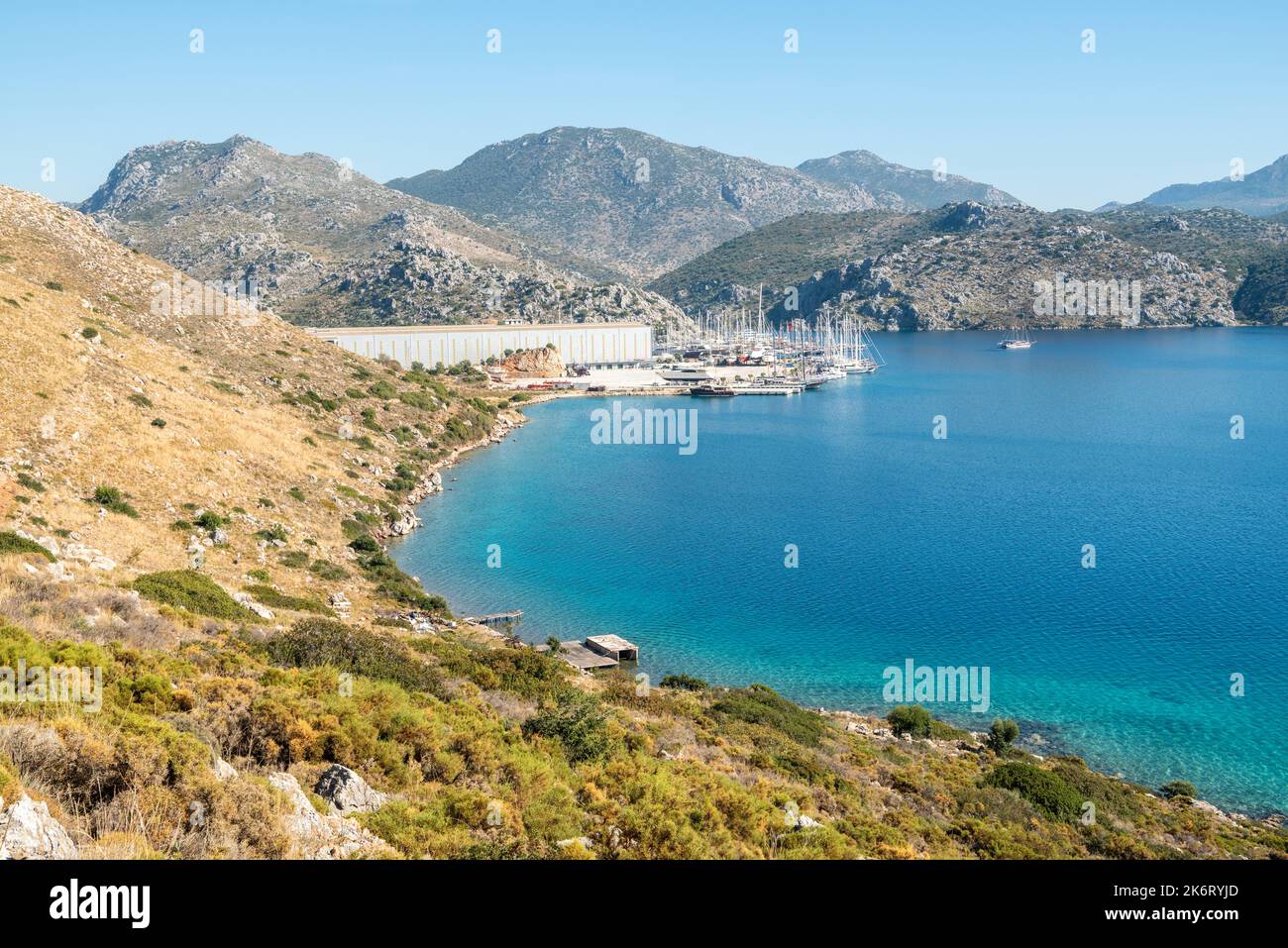 Bozburun, Mugla, Turkey – November 7, 2021. View of the Mediterranean coastline, toward Tum-Tour Shipyard and drydock and DSV Yatcilik Marina in Bozbu Stock Photo