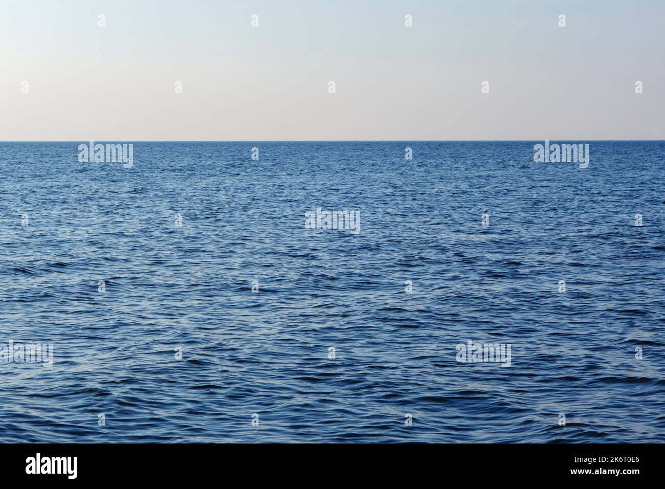 Seascape with blue calm water and blue sky, travel and relaxation concept Stock Photo