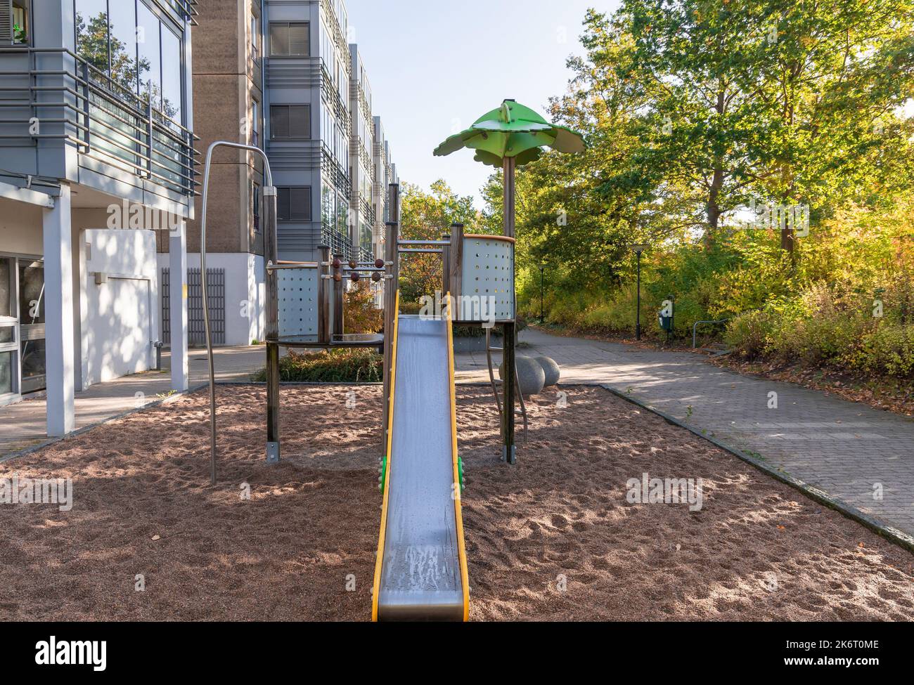 House facade in Copenhagen, Denmark. Residential building with playground. Real estate
