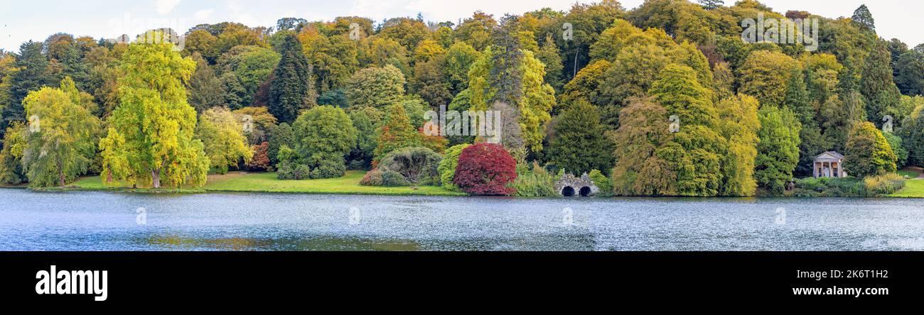 Panorama of multi coloured trees and shrubs in golden autumn colours in Stourhead, Wiltshire, UK on 15 Ocotber 2022 Stock Photo