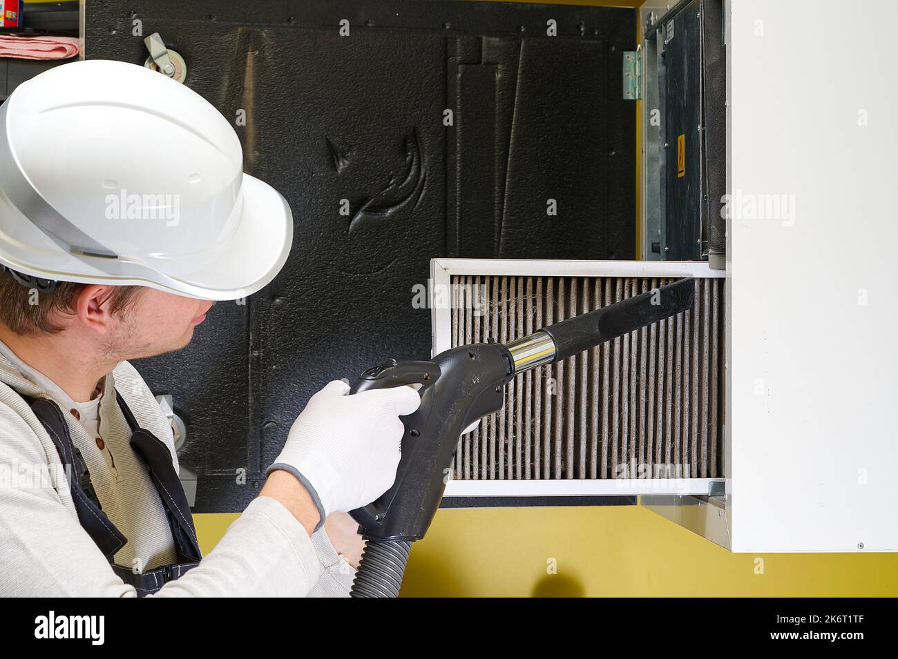 hvac filter replacement home central air system. servicemen changing