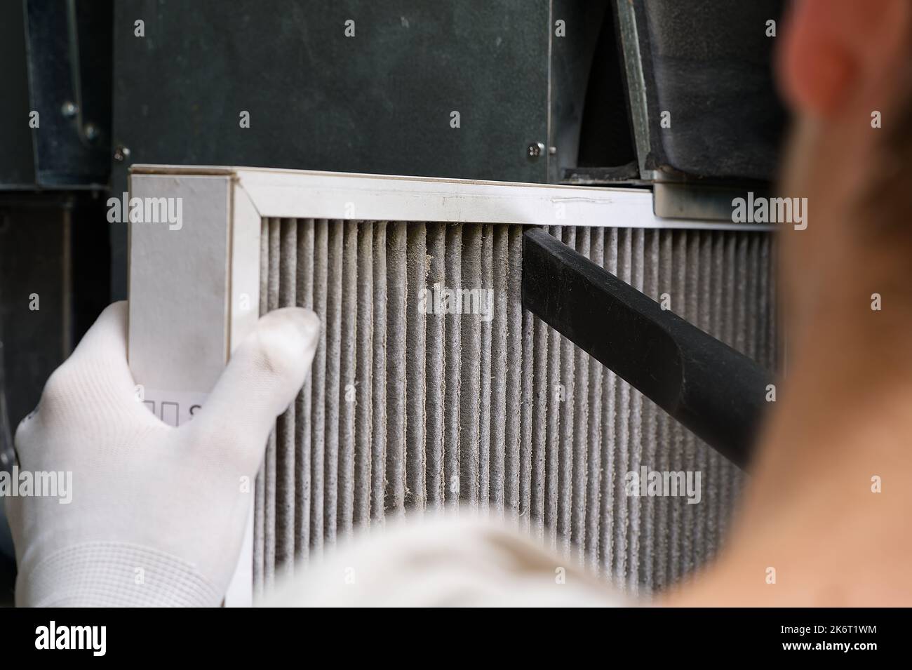 Replacing filter in the central ventilation system. hvac filter replacing home central air system Stock Photo