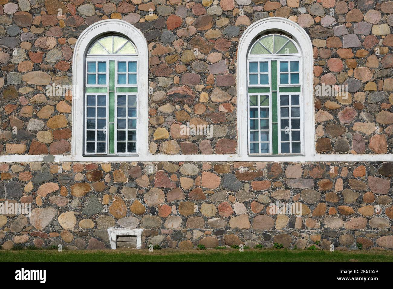 Middle Age Window Arched windows in a aged stonewall of an old building Stock Photo - Alamy