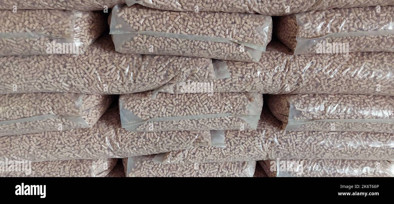 Wood pellets in plastic bags. Environmentally friendly fuel.Wood