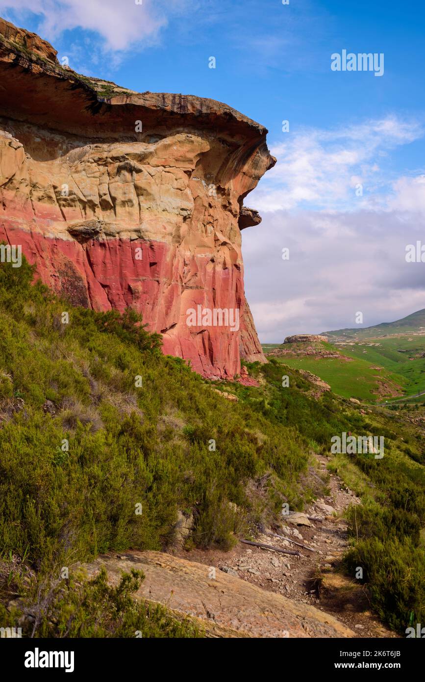 A rocky hiking trail leading past the cliffs of Mushroom Rock in the Golden Gate Highlands National Park. This is a nature reserve near the popular to Stock Photo