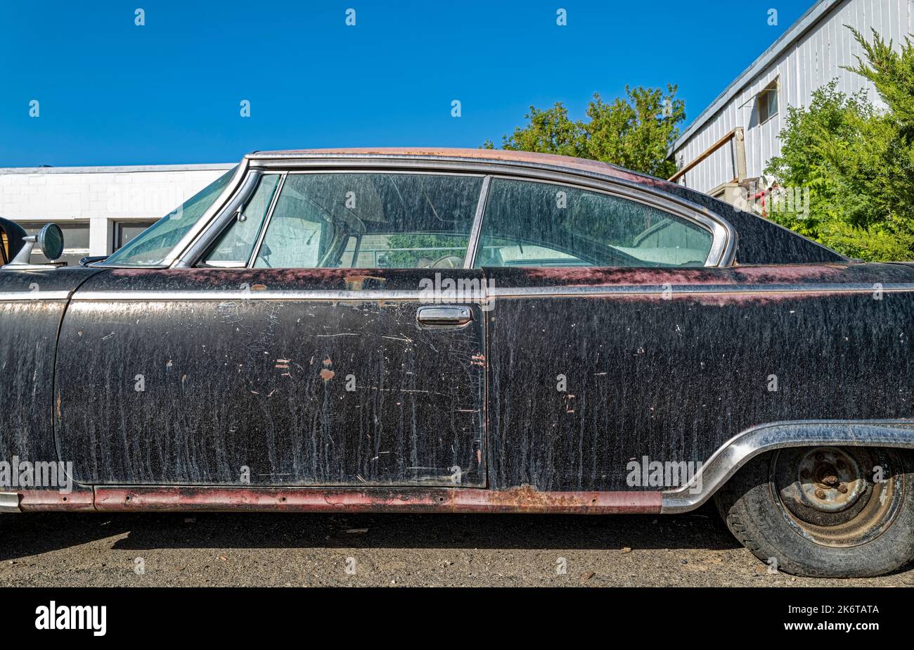 The driver side door of a rusty 1960 Plymouth Fury coupe in Wells, Nevada, USA Stock Photo