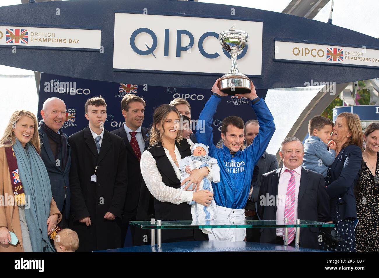 Ascot, Berkshire, UK. 15th October, 2022. A proud family as William Buick realised a long-held ambition at Ascot today as he was crowned Champion Jockey for the first time. Racing legend Willie Carson presented him with the trophy. The 34-year-old has dominated the championship from the outset and begins the final day of the season on 157 winners, 67 clear of his closest challengers Hollie Doyle and Tom Marquand. Credit: Maureen McLean/Alamy Live News Stock Photo