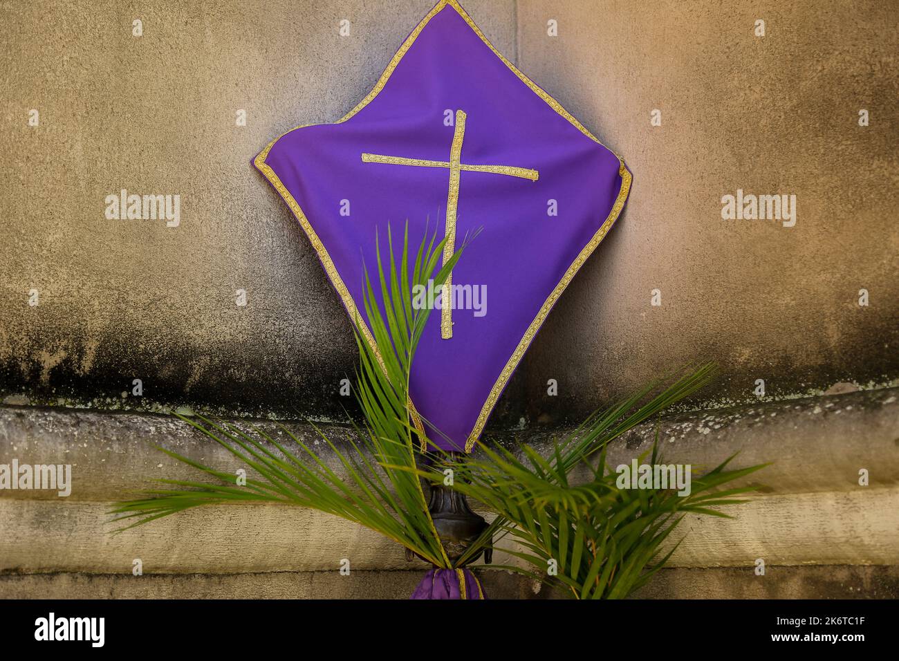 Holy Week. Cross covered with purple fabric in the period of lent