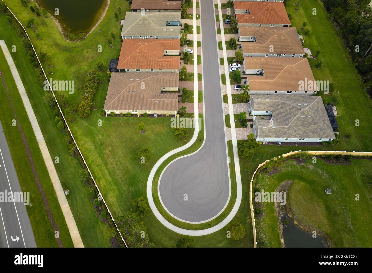 Aerial view of cul de sac at neighbourhood road dead end with densely