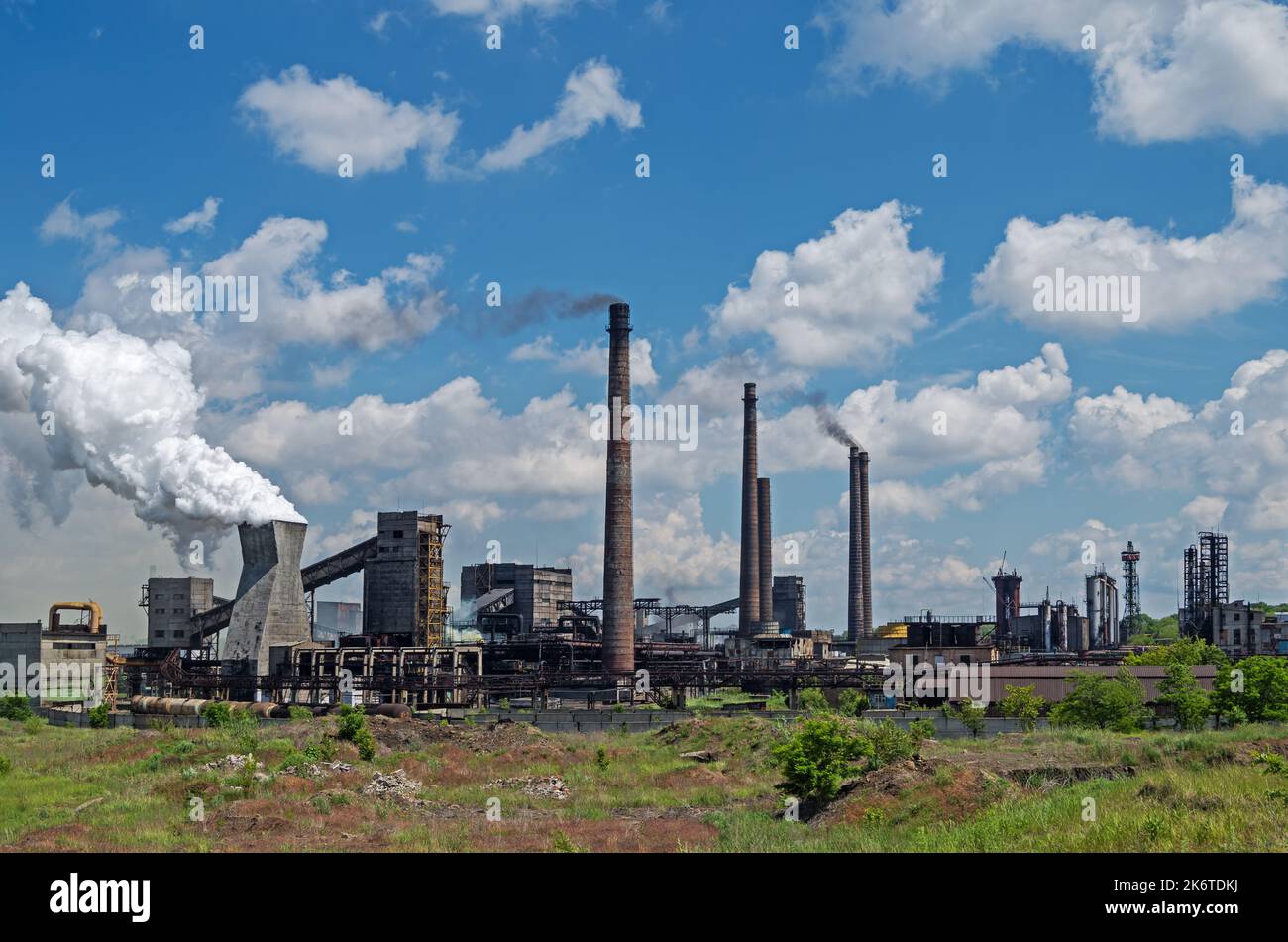 Plant for production of coke from hard coal on cloudy sky background in sunny summer day Stock Photo