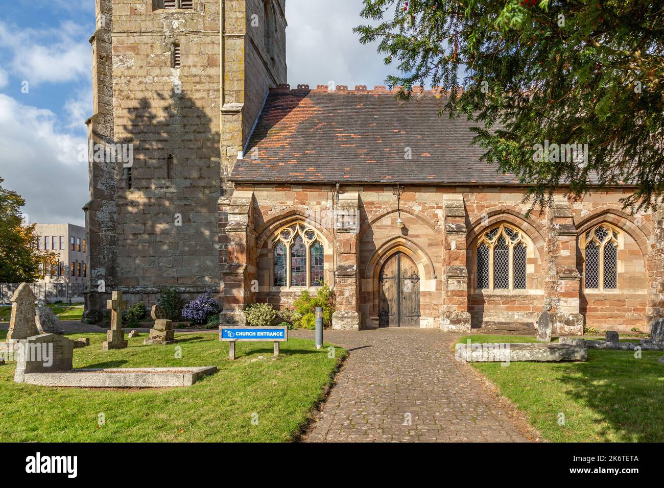 St. Peter's Church on Ipsley Church Lane, Redditch, on a sunny autumn day with blue sky. Stock Photo