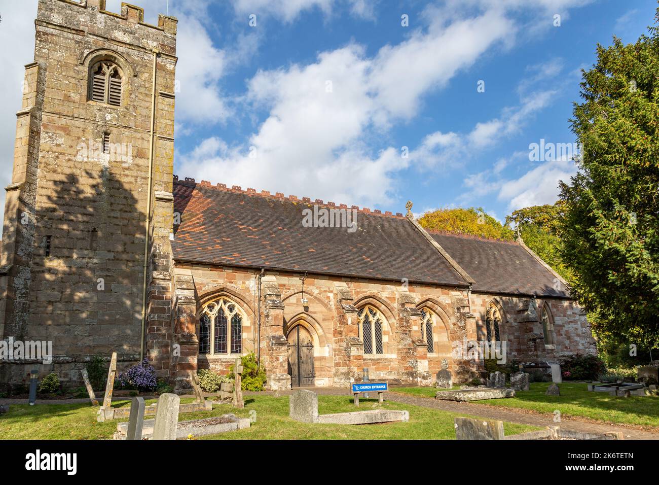 St. Peter's Church on Ipsley Church Lane, Redditch, on a sunny autumn day with blue sky. Stock Photo