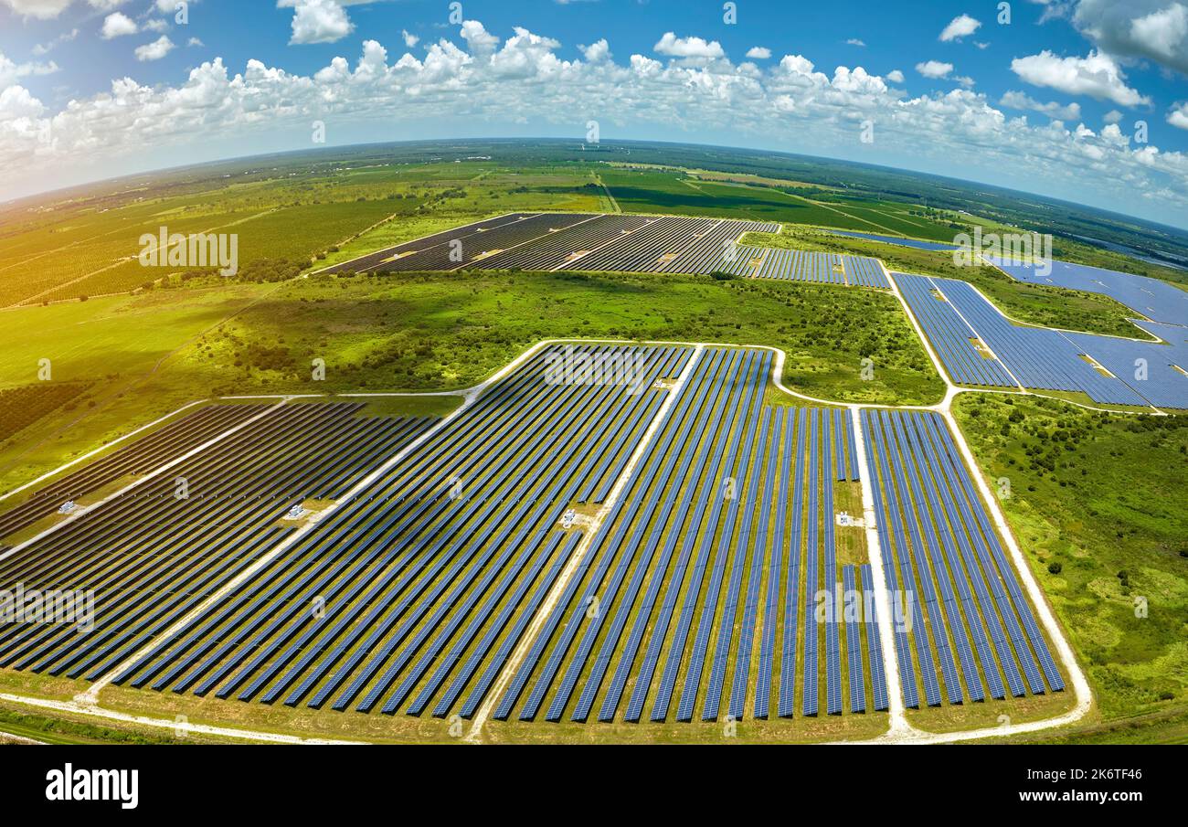 Aerial view of large sustainable electrical power plant with rows of ...