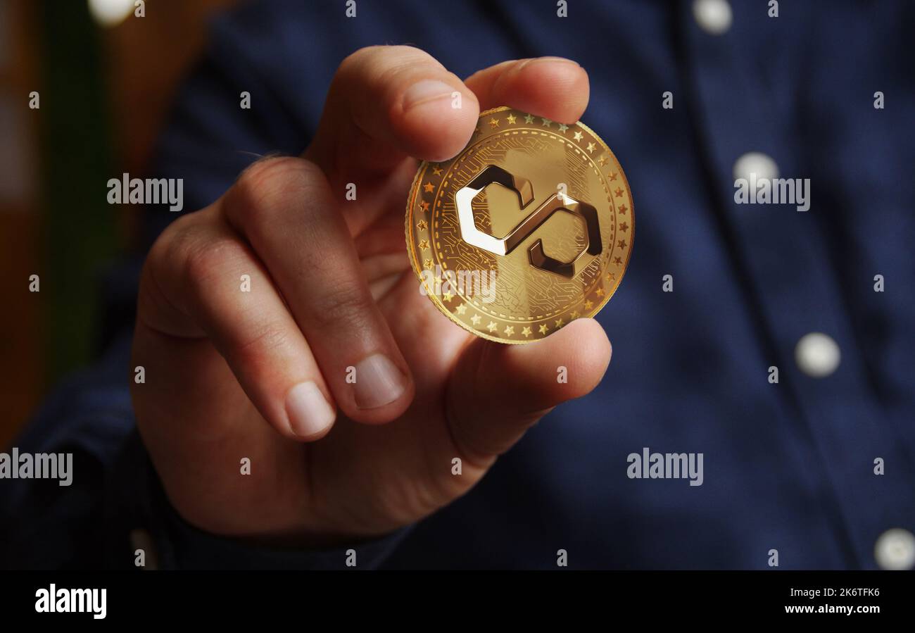 Polygon Matic cryptocurrency symbol golden coin in hand abstract concept  Stock Photo - Alamy