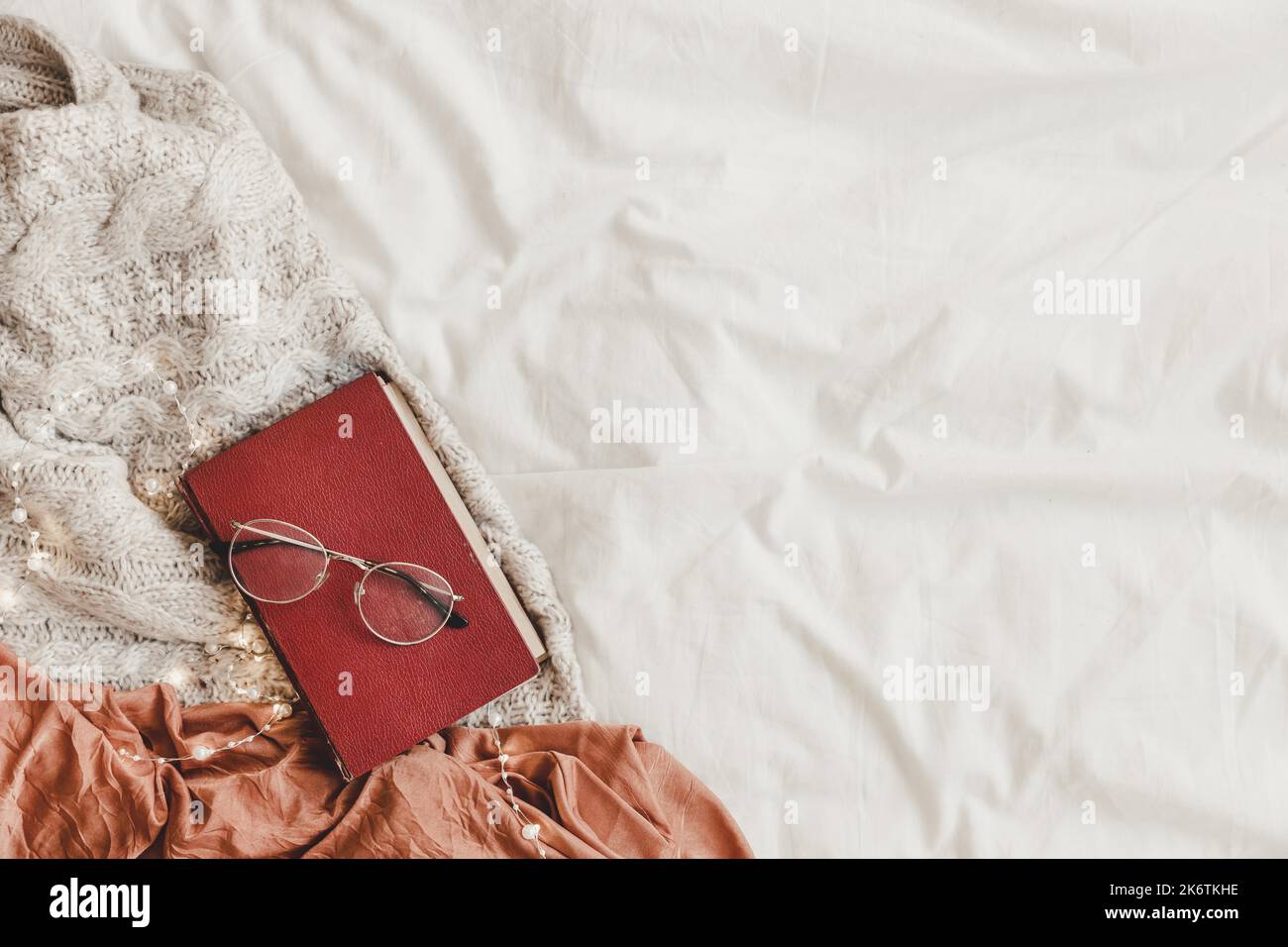 Book glasses bed Stock Photo