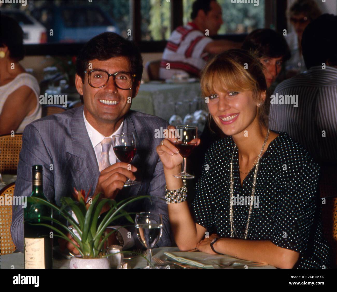 Couple in pub drinking red wine Stock Photo