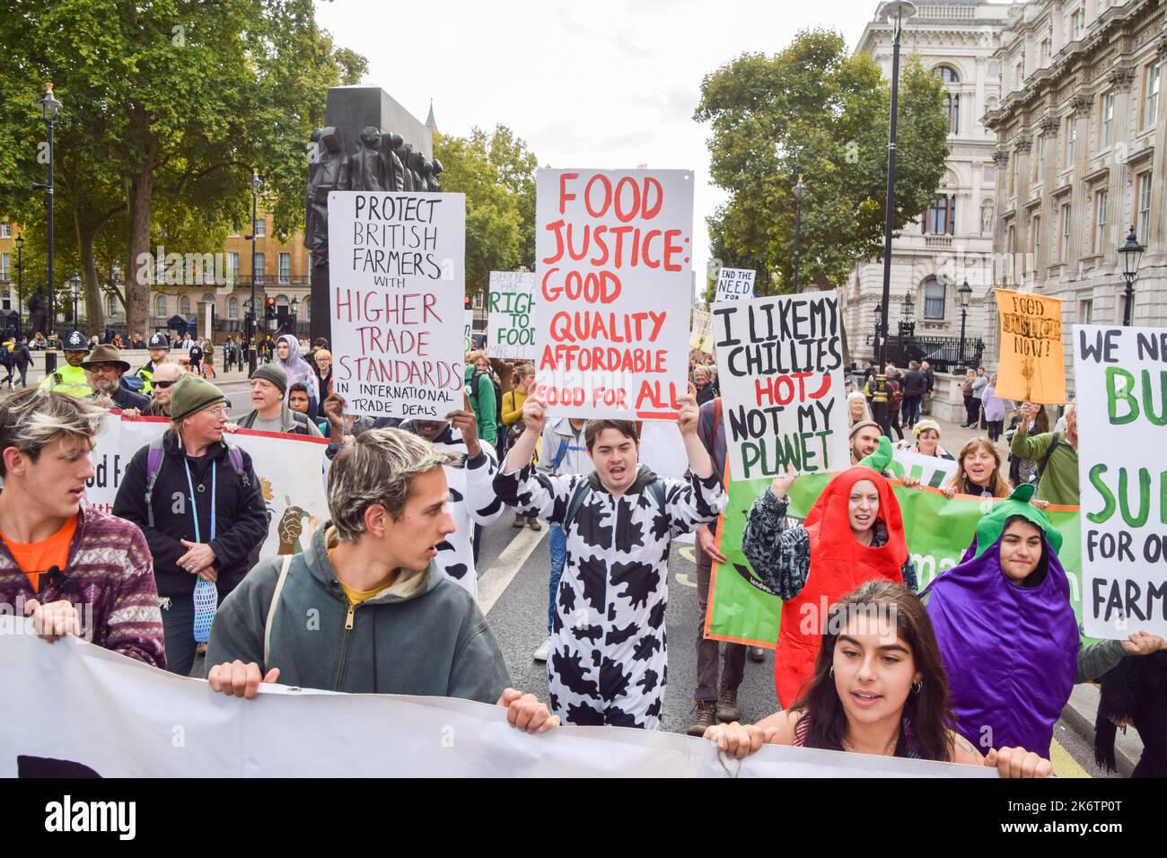 London, UK. 15th Oct, 2022. A protester holds a 'Food justice' placard during the march in Whitehall. Farmers and supporters marched in Westminster demanding a better food and farming system in the UK, to save environmental land management schemes, and to protect nature. Credit: SOPA Images Limited/Alamy Live News Stock Photo