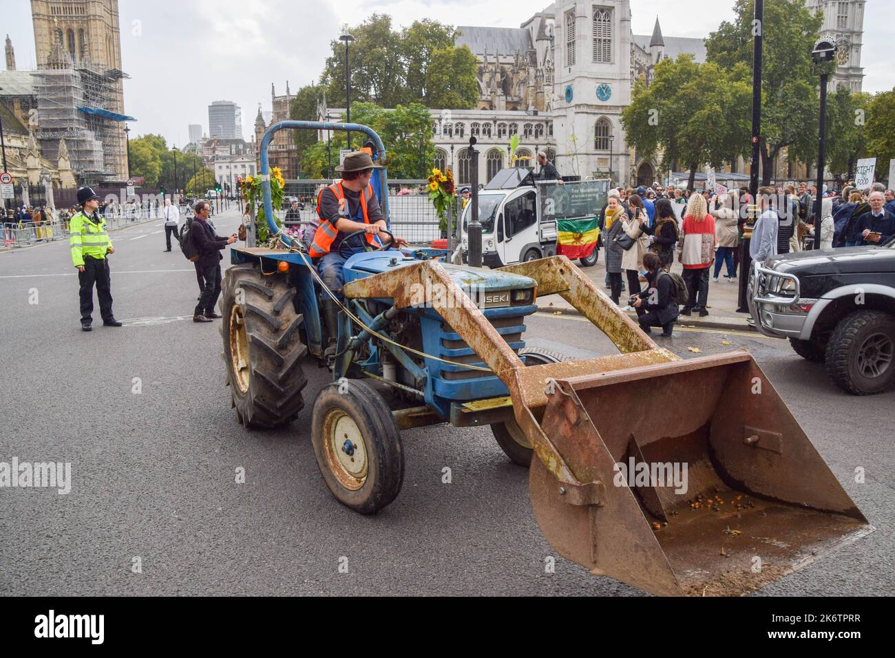 London, UK. 15th Oct, 2022. A protester drives a tractor during the march in Parliament Square. Farmers and supporters marched in Westminster demanding a better food and farming system in the UK, to save environmental land management schemes, and to protect nature. (Photo by Vuk Valcic/SOPA Images/Sipa USA) Credit: Sipa USA/Alamy Live News Stock Photo