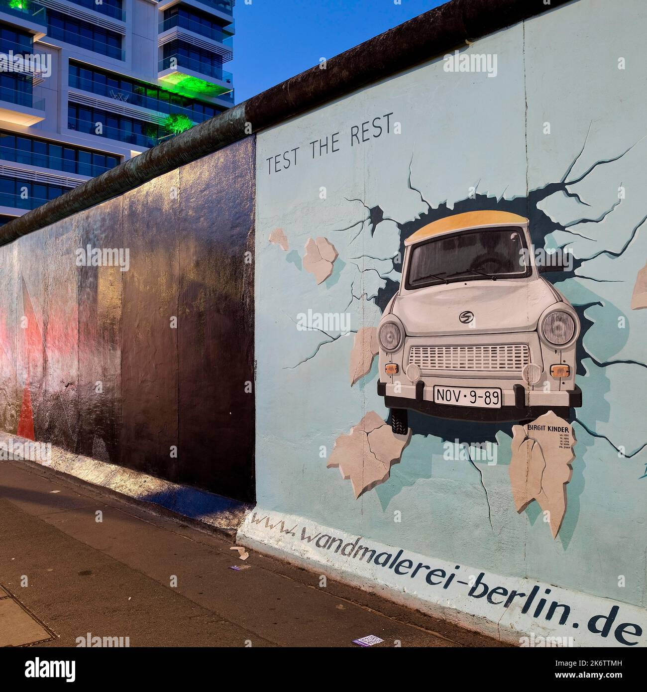 Mural on the rest of the Berlin Wall with the cardiac stress test (Test The Rest), Trabi durchbricht Mauer, artist Birgit Kinder, East Side Gallery Stock Photo