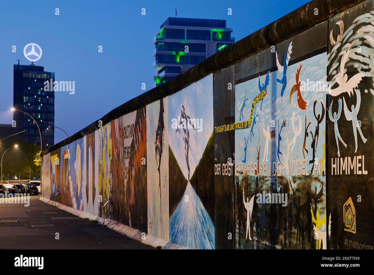 Mural on the Berlin Wall with Mercedes star, Berlin, Germany, East Side Gallery in the blue hour, Berlin, Germany Stock Photo