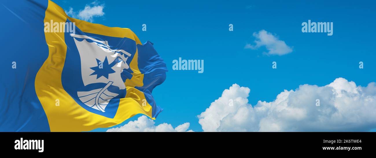 flag of Baltic Finns Saaremaa people at cloudy sky background, panoramic view. flag representing ethnic group or culture, regional authorities. copy s Stock Photo