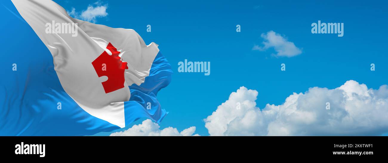flag of Baltic Finns Votes at cloudy sky background, panoramic view. flag representing ethnic group or culture, regional authorities. copy space for w Stock Photo