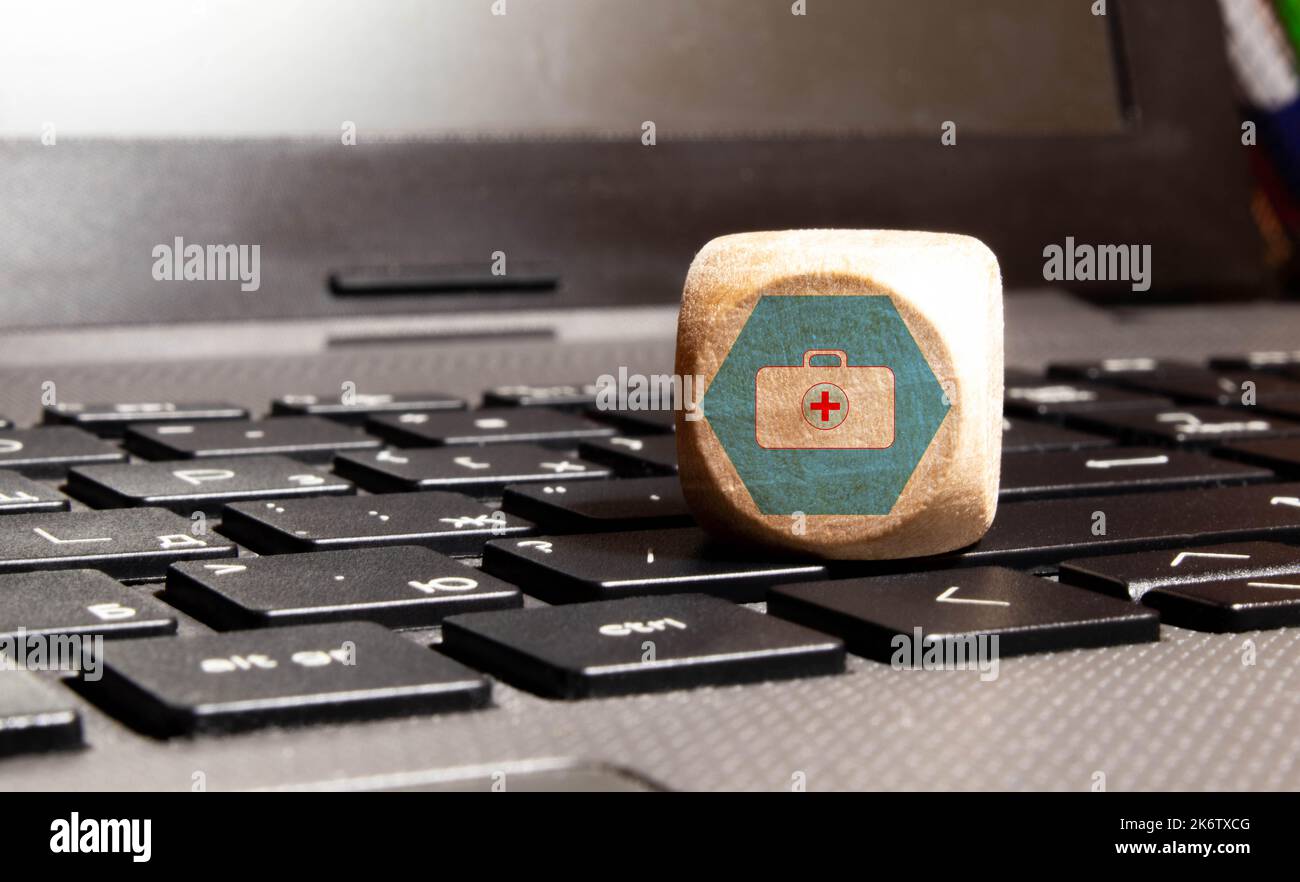wood cube with a medical symbol angle Flat lay,Concept: Health insurance family covid-2019 epidemic,management protect healthcare to a virus,Internati Stock Photo