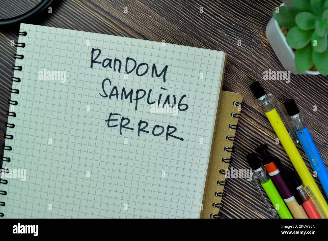 Concept of Random Sampling Error write on a book isolated on Wooden Table. Stock Photo