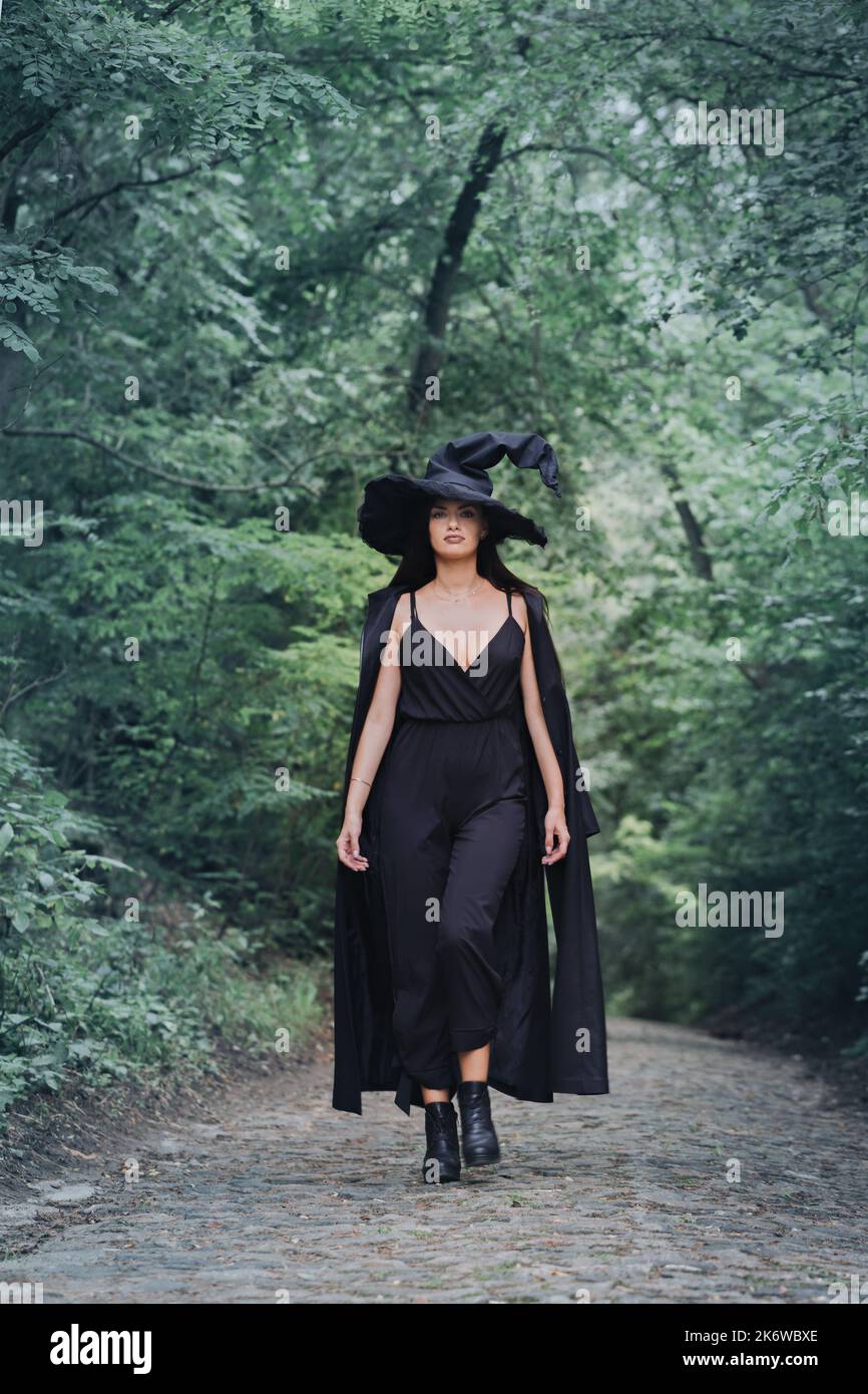 Back view woman in cloak hi-res stock photography and images - Alamy