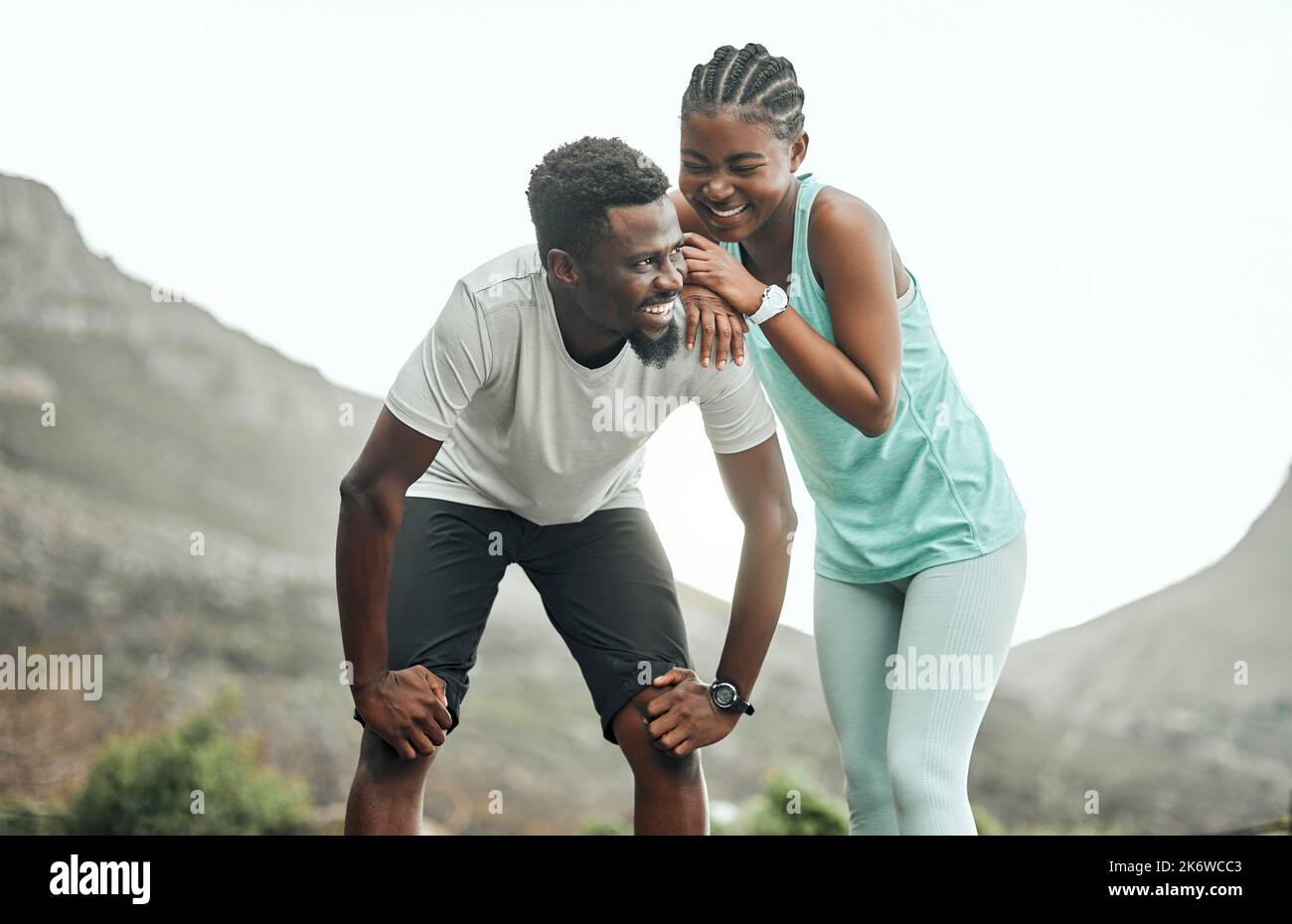 Taking break to catch our breath. a young couple taking a break during a workout. Stock Photo