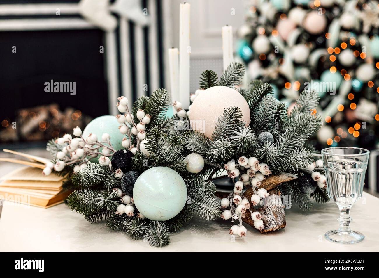 New Year's wreath in the living room. New Year's interior and fireplace