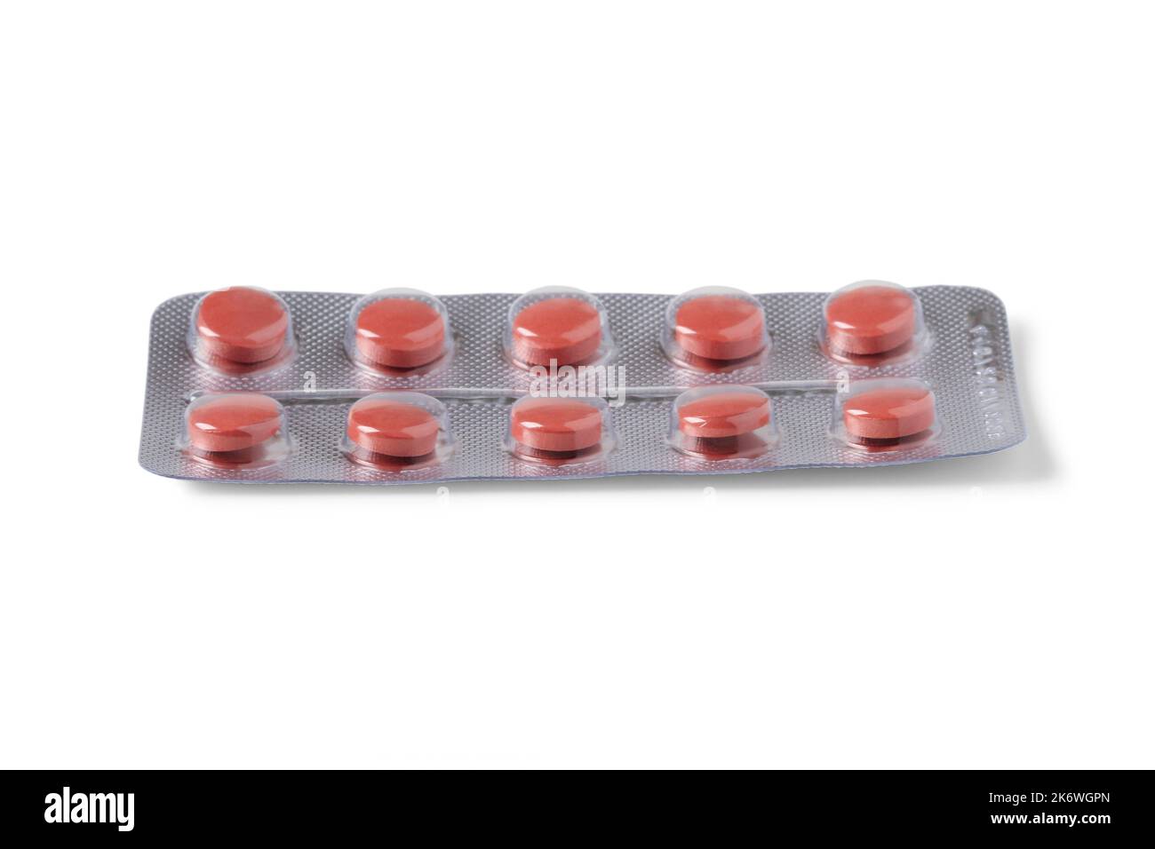 Red pills in blister pack isolated on white background Stock Photo