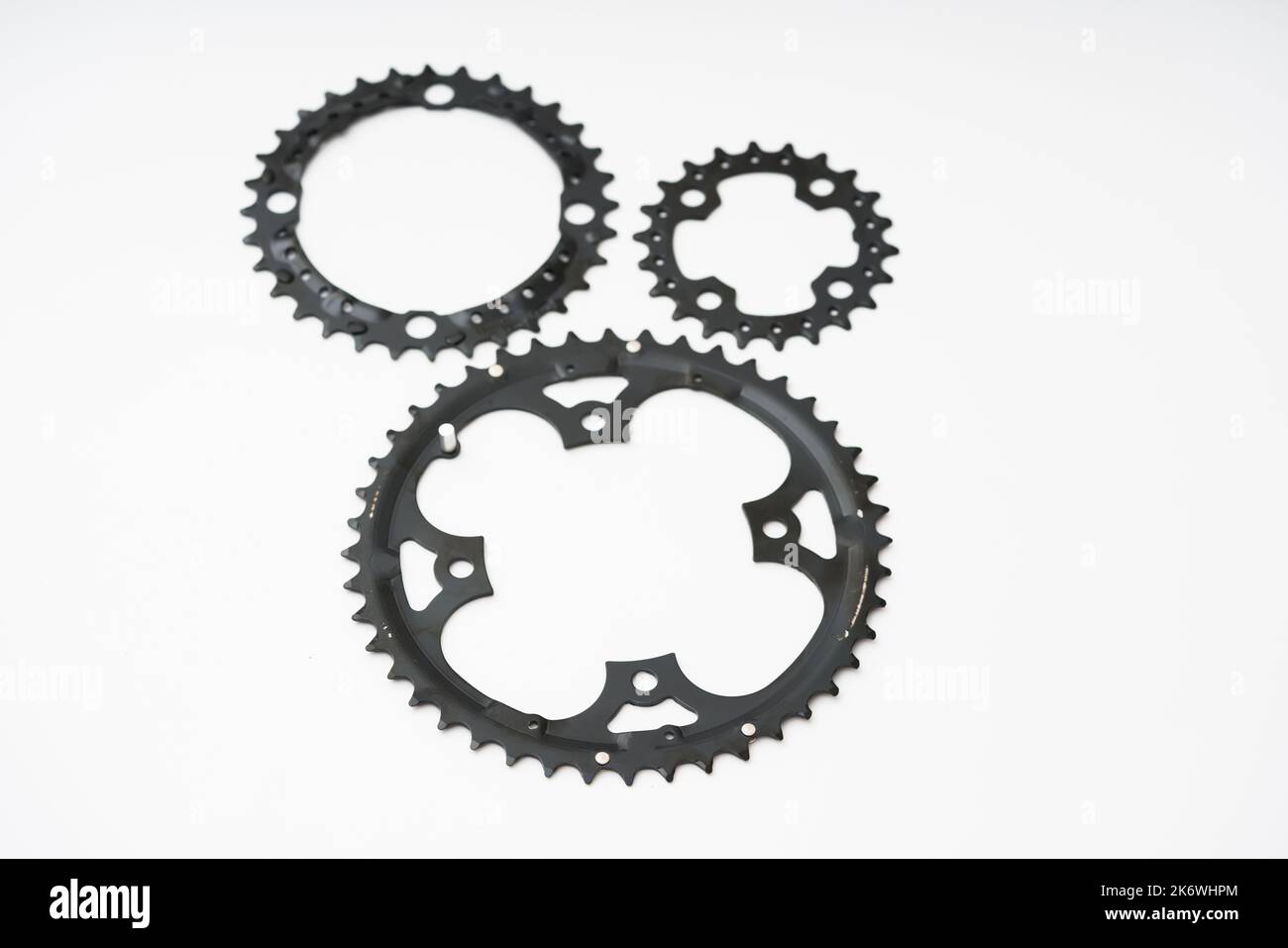 Gears, sprockets and chain of a mountain sports bike on a white background. Bicycle parts Stock