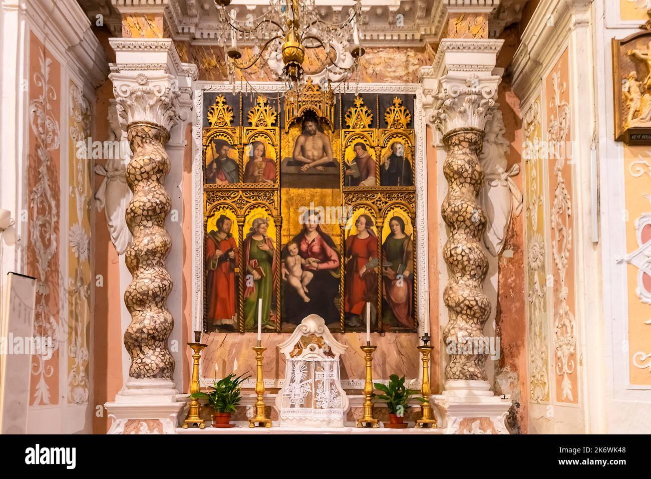 Altar with painting of Madonna and Child with saints, polyptych of 1540 by A. Casanova. Parish church of San Michele of Villatalla. Municipality of Pr Stock Photo