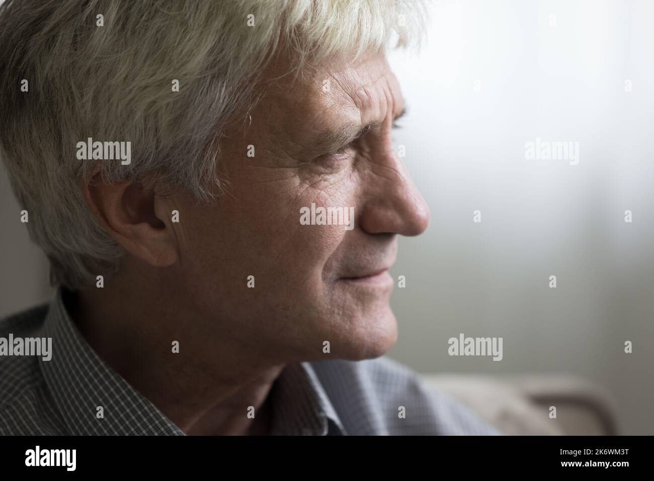 Closeup face of pensive sad senior man staring into distance Stock Photo