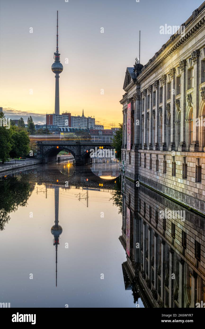 The river Spree, the TV Tower and the facade of the Bode-Museum in Berlin before sunrise Stock Photo