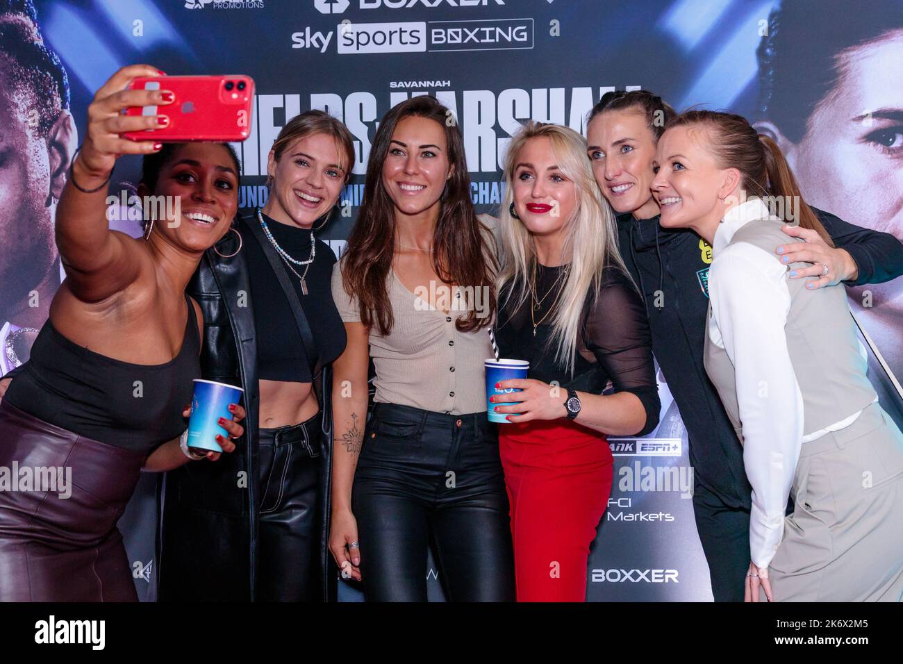 The O2, London, UK. 15th October 2022.  Ebony Rainford-Brent, Laura Crane, Lucy Cork, Aimee Fuller, Jill Scott and Shelley Unitt take a selfie on the red carpet at The O2 for the first-ever all-female boxing event in history.  Savannah Marshall and Claressa Shields will headline Boxxer’s Legacy show for the Undisputed World Middleweight Title. Photo by Amanda Rose/Alamy Live News Stock Photo