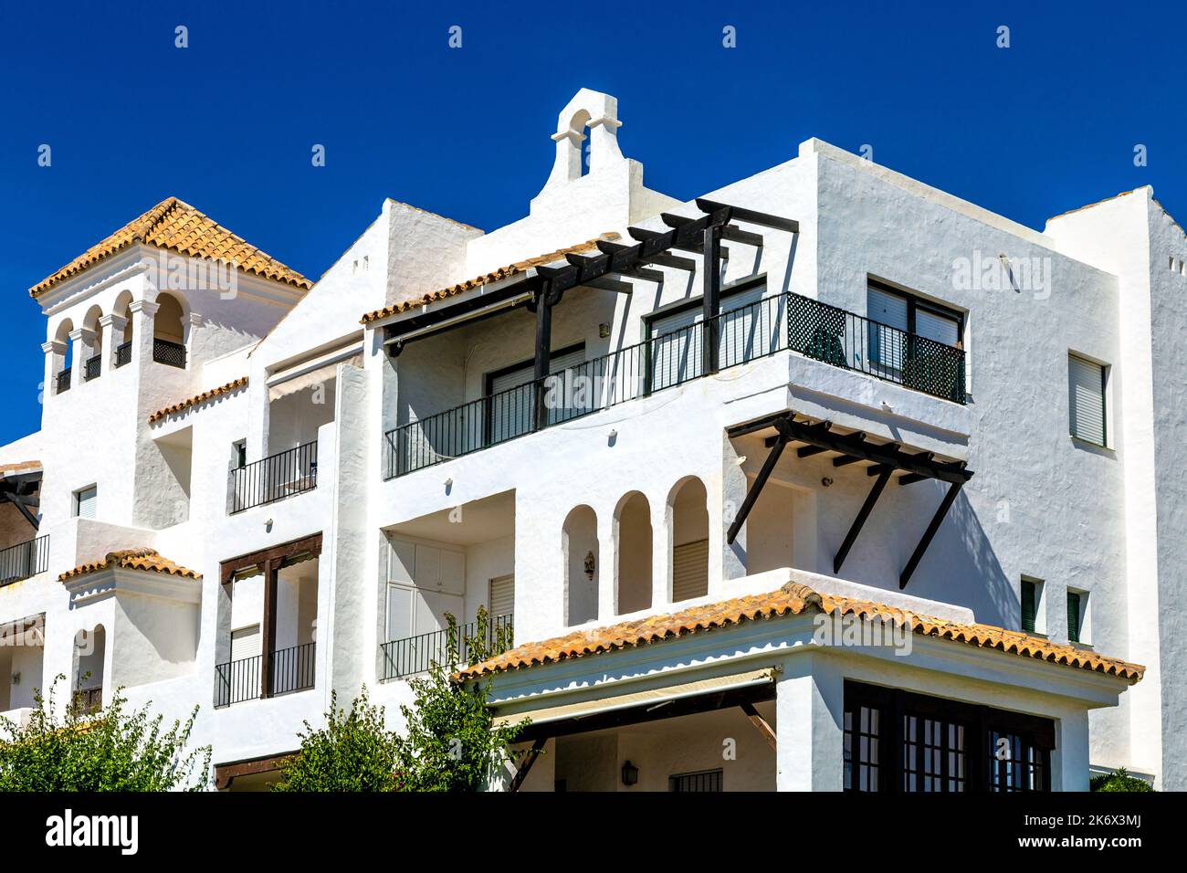 Spanish moorish style, whitewashed houses along Playa de la Barrosa, Costa de la Luz, Cadiz, Spain Stock Photo