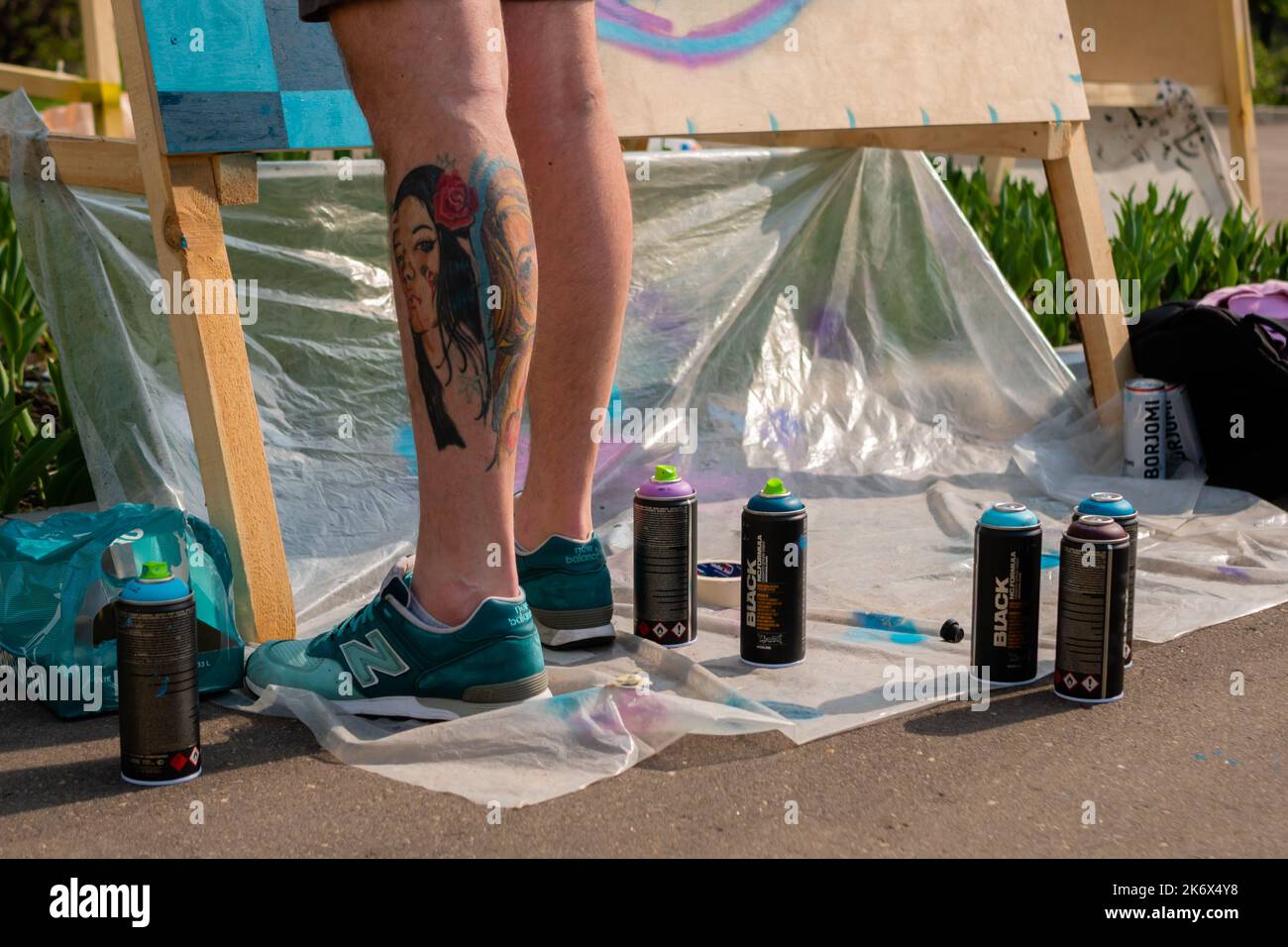 Set of used spray paint cans at summer graffiti festival Stock Photo