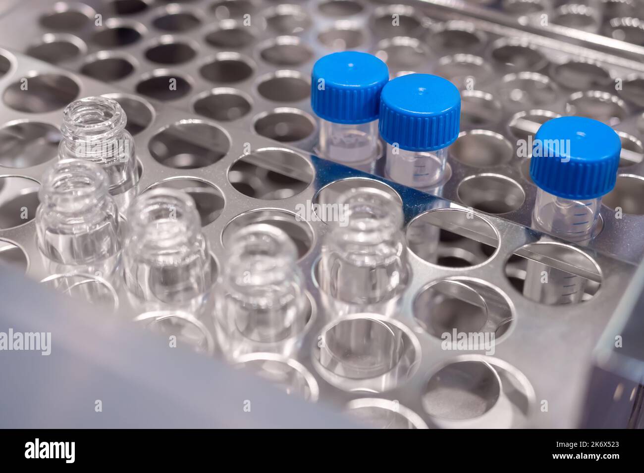 Medical glass vials in showcase at pharmaceutical exhibition Stock